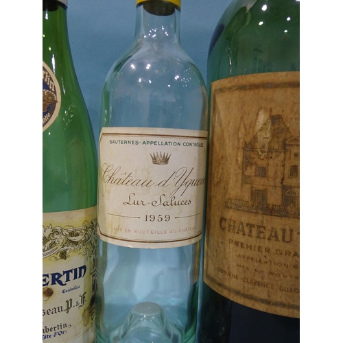 221 - A collection of eight empty wine bottles, well-known labels, including a jeroboam of Chateau Haut-Br... 