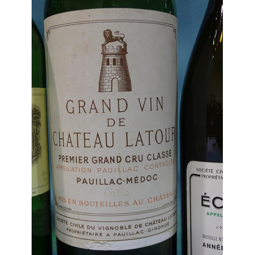 221 - A collection of eight empty wine bottles, well-known labels, including a jeroboam of Chateau Haut-Br... 