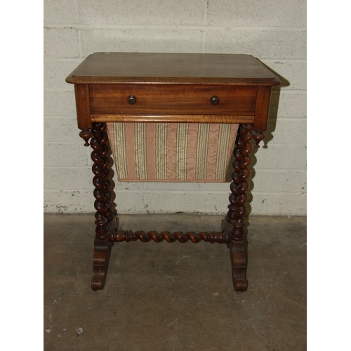 69 - A Victorian mahogany work table, having a frieze drawer above a sliding work basket, on spiral turne... 