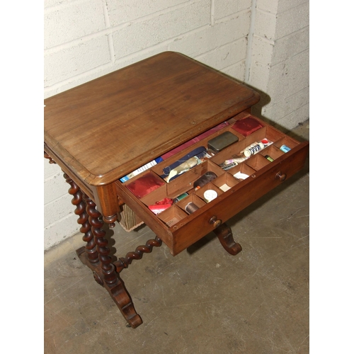 69 - A Victorian mahogany work table, having a frieze drawer above a sliding work basket, on spiral turne... 