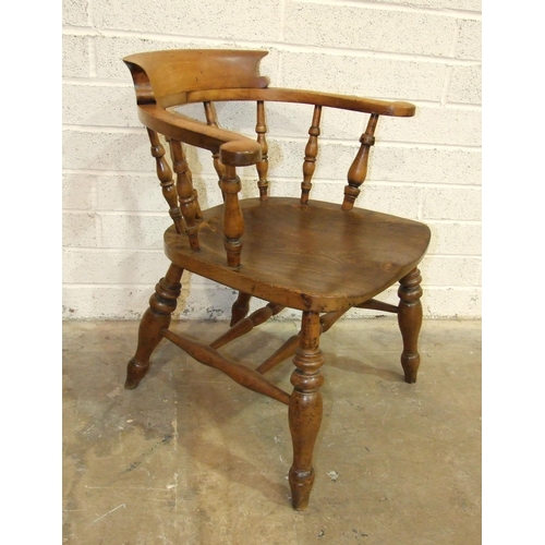 72 - An elm and beech captain's or smoker's bow armchair.