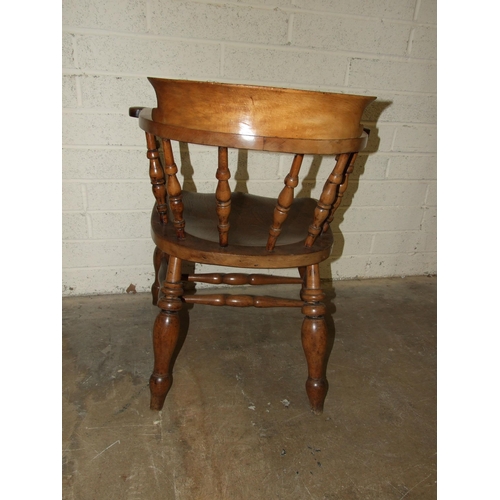 72 - An elm and beech captain's or smoker's bow armchair.