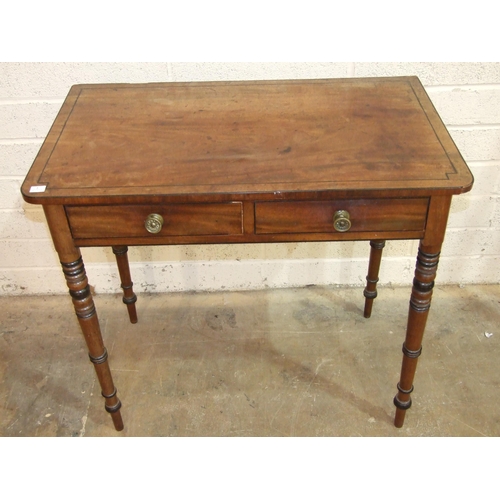 76 - A George IV ebony inlaid mahogany two-drawer side table on ring-turned legs, 82cm wide, 48cm deep, 7... 