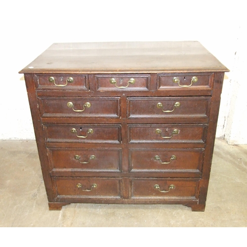 83 - An antique oak rectangular chest having an arrangement of eleven small drawers of varying size, 108c... 