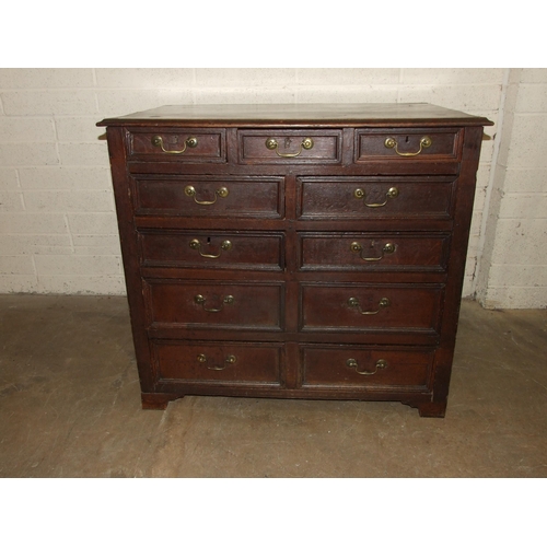 83 - An antique oak rectangular chest having an arrangement of eleven small drawers of varying size, 108c... 