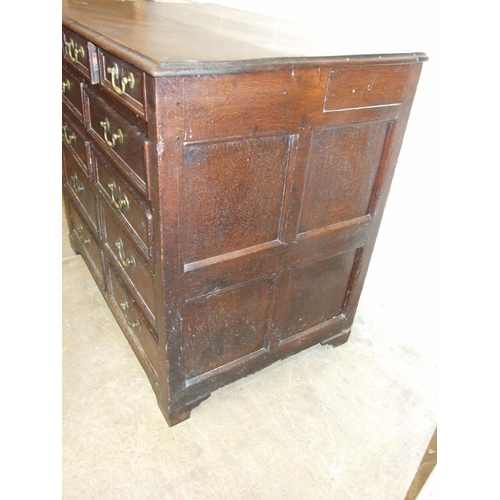 83 - An antique oak rectangular chest having an arrangement of eleven small drawers of varying size, 108c... 