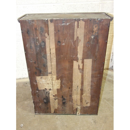 86 - An African hardwood two-door glazed wall cabinet of rectangular shape, 54 x 77cm high, bears labels ... 