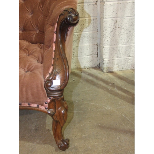 91 - A Victorian rosewood single-ended chaise longue, the carved frame, upholstered button-back and serpe... 