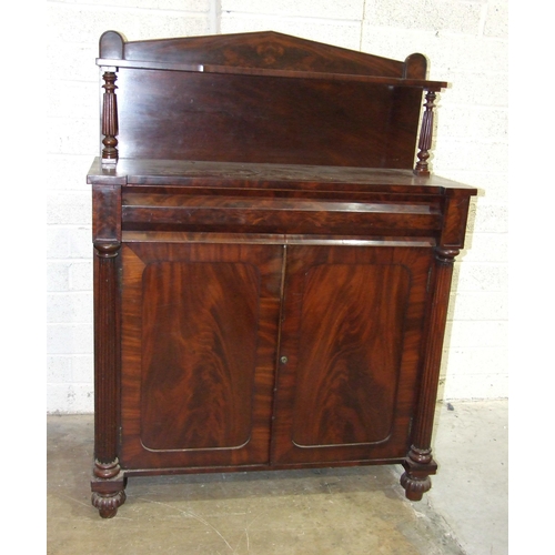 103 - An early-19th century mahogany chiffonier, the shelved back above a frieze drawer and two cupboard d... 