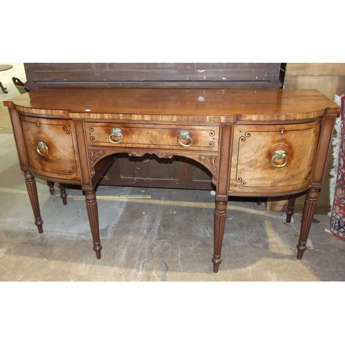 107 - A George IV ebony inlaid mahogany breakfront sideboard, the central drawer flanked by a cupboard doo... 