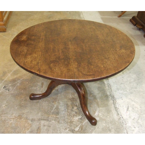 110 - An antique oak tripod table, cut-down to form a coffee table, 80cm diameter.