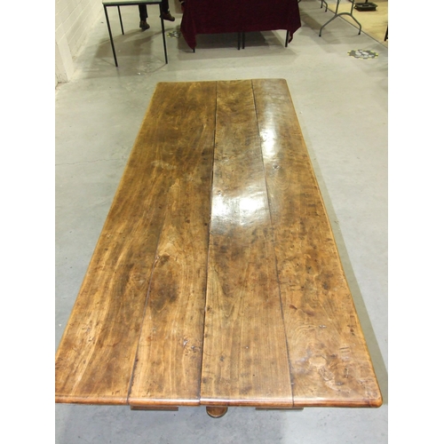 60 - A large chestnut refectory-style table, the four-planked top on solid end supports joined by pegged ... 