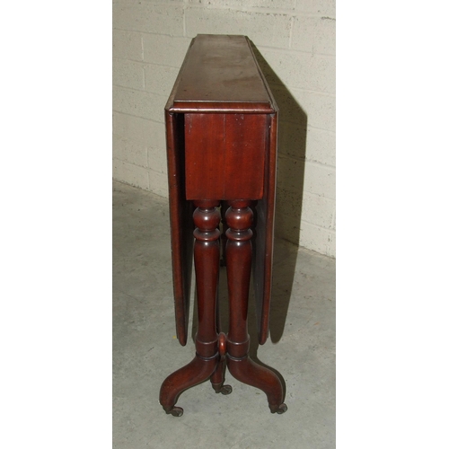 71 - A Victorian mahogany drop-leaf Sutherland table on turned supports and gate legs, 89cm wide, 104cm o... 