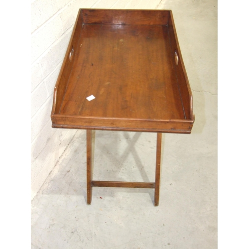 74 - A 19th century walnut butler's tray with folding stand and a low window seat/bench on turned legs, 9... 