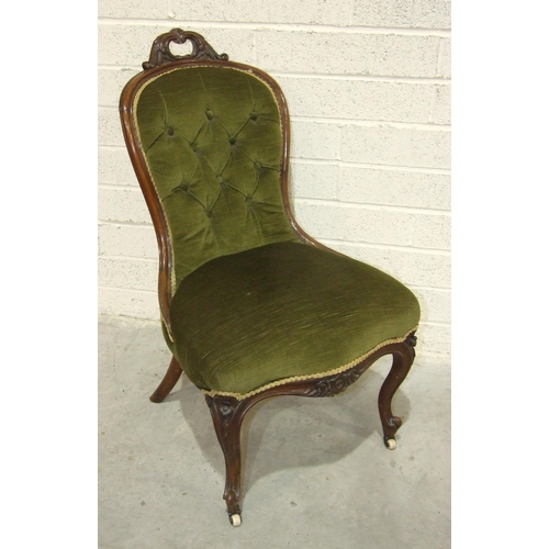 75 - A Victorian walnut low salon chair, with carved frame and serpentine seat.