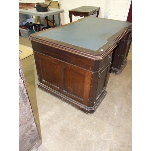 84 - A late-19th/early-20th century oak partner's desk, the top of broken outline having two small drawer... 