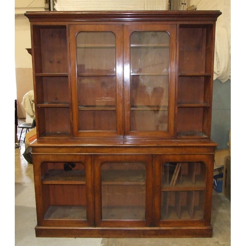 88 - A Victorian mahogany library bookcase, the moulded cornice above a pair of plain-glazed doors flanke... 