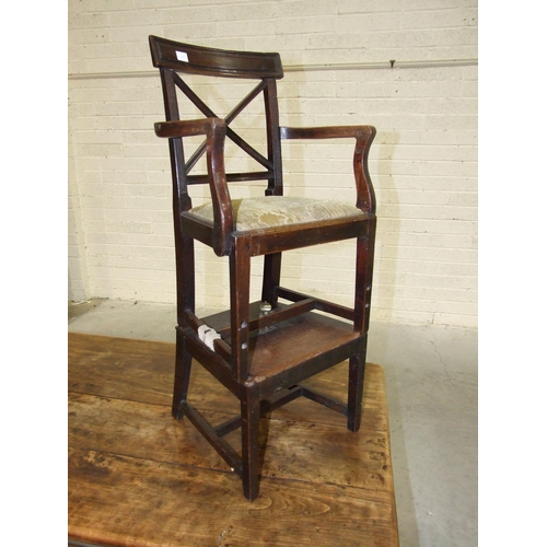 94 - A Georgian mahogany child's high chair with open back and drop-in seat, on square tapered legs to th... 