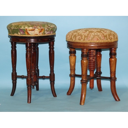 61 - Two hardwood revolving piano stools, each with circular upholstered seat, on turned splayed legs, (o... 