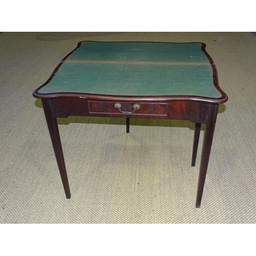 89 - A George III mahogany serpentine-shaped fold-over card table with frieze drawer, on square moulded l... 