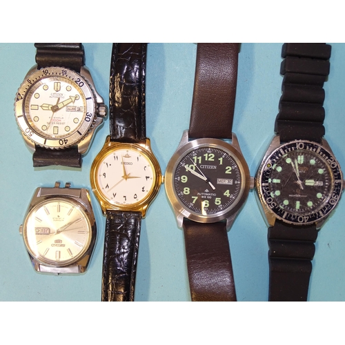 327 - A Citizen Automatic WR100 wrist watch, two other Citizen wrist watches, a Seiko 5 wrist watch with S... 