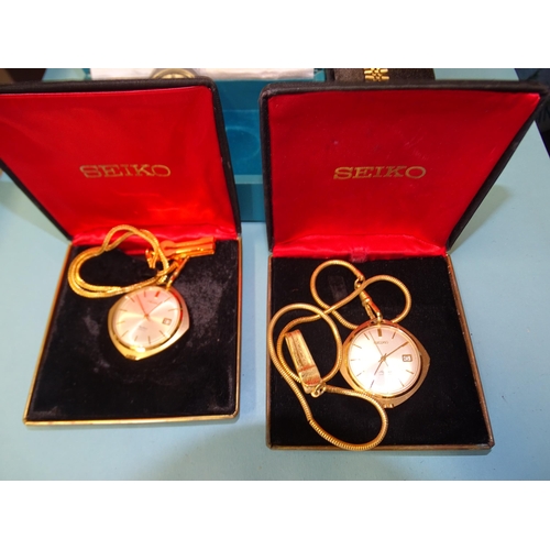 328 - Two Seiko Skyliner open-face pocket watches with gold-plated cases and watch chains, (both boxed) an... 