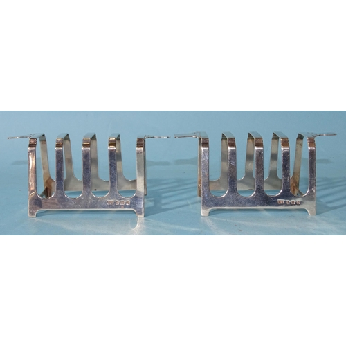 477 - A pair of Art Deco silver four-division toast racks, 11cm wide, 5cm high, Birmingham 1938, maker Wil... 