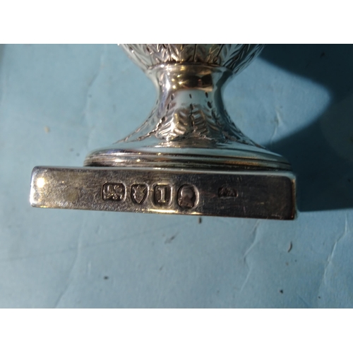 478 - A George III silver urn shape pedestal cream jug on square base with scrolling handle and leaf decor... 