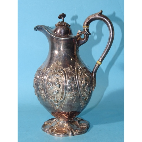 483 - A Victorian silver pear-shaped chocolate pot, the hinged cover with floral finial, the body with emb... 