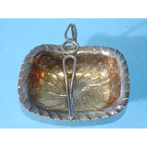 502 - A silver basket with embossed decoration and swing handle, on four ball feet, 14.5 x 11.5cm, 12.5cm ... 