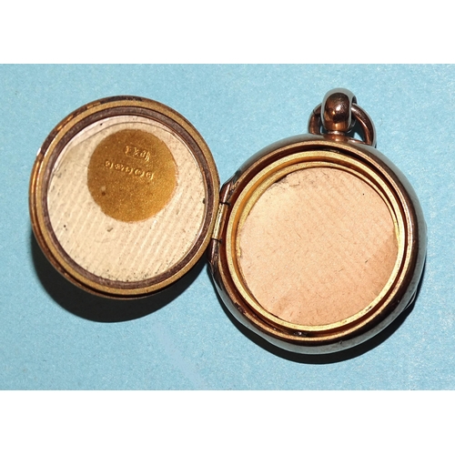 65 - A 9ct gold circular double-sided locket, 23mm, gross weight 8.3g.