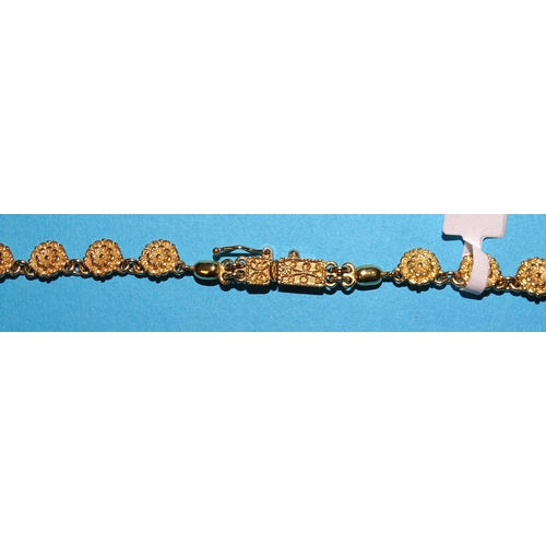 97 - A foreign gold necklace of graduated rosettes and a pair of matching earrings, all marked 18k, 33.3g... 