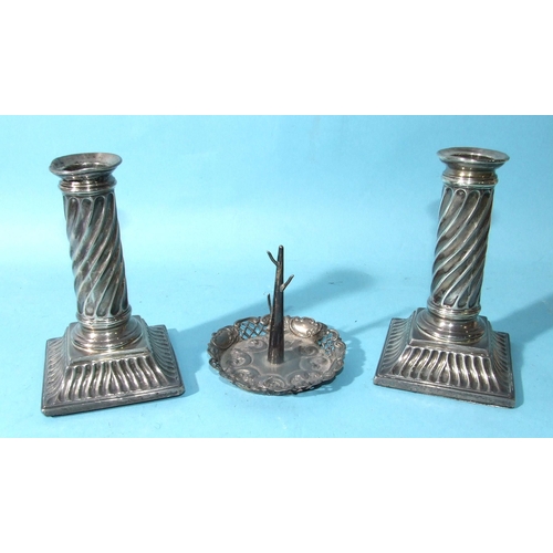 505 - A pair of short loaded candlesticks with twist reed stems, on square bases, 14cm high, (marks rubbed... 