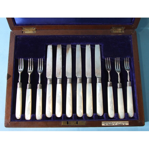 513 - A set of six fruit knives and forks with mother-of-pearl handles, in fitted case, for Carrington &am... 