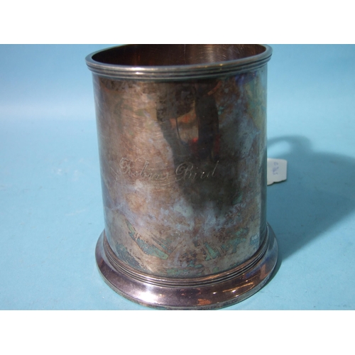 522 - A plain silver tankard with reeded borders, Birmingham 1930, 11cm high, (foot rim bent), ___11oz.... 