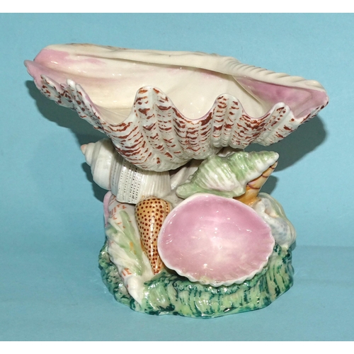 132 - A 19th century Royal Worcester dish in the form of an upturned clam shell, on naturalistic base cove... 