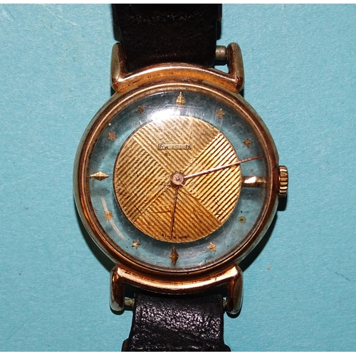 252 - Marvin, an unusual gold-plated wrist watch, the face with engraved centre disc within glass chapter ... 