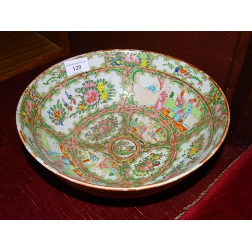 129 - A 19th century Canton bowl, typically-decorated with panels of figures, birds and flowers, 26cm diam... 