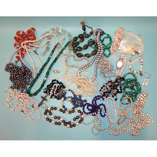 230 - A large quantity of bead necklaces, including amethyst, lapis lazuli, malachite, coral and freshwate... 