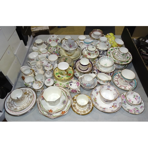 98 - A collection of Minton, Worcester, Cauldon, Wedgwood, Copeland and other trios, cups and saucers and... 