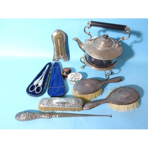 136 - Two silver-backed hair brushes, a silver-plated spirit kettle, plated grape scissors, a silver-handl... 