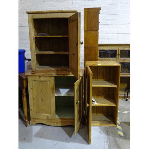 17 - A two-door pine cupboard, 80cm high, 80cm wide and two other pine cupboards, (3).