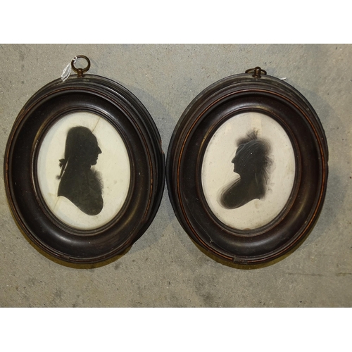 70 - A pair of oval silhouette portraits on plaster, possibly Robert Bogle and Margaret Bogle, each 9 x 7... 