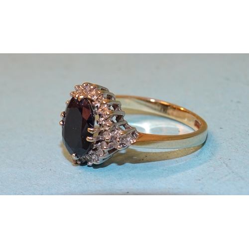 104 - A sapphire and diamond cluster ring claw-set an oval sapphire within a border of 8/8-cut diamonds, i... 