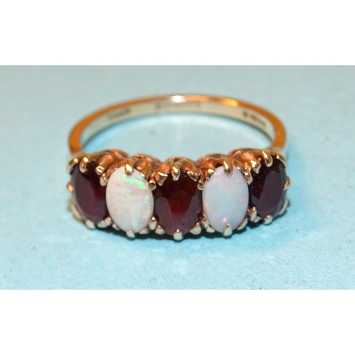 106 - A 9ct gold ring set two oval opals and three garnets, size O, 3g.