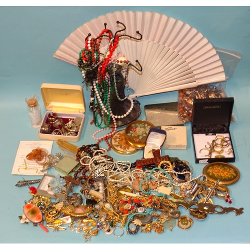 82 - A large quantity of costume jewellery, including leaf and butterfly brooches, beads and other jewell... 