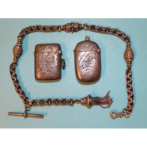 83 - Two silver Vesta cases with engraved decoration and a white metal fancy-link watch chain with tassel... 