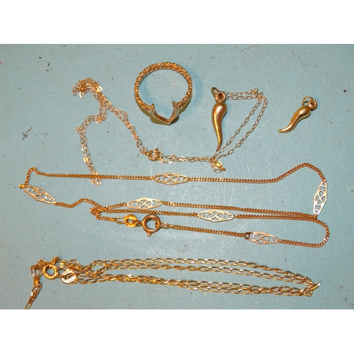 96 - Three 9ct gold neck chains, two pendants and a wishbone ring, total weight 6.5g.