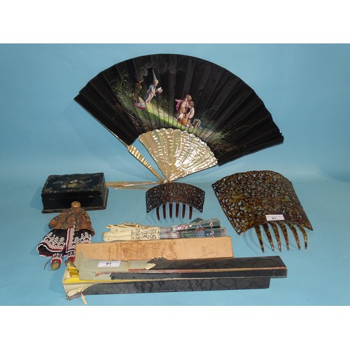 91 - A large 'tortoiseshell' mantilla with pierced decoration, 31 x 23cm, a 19th century fan with mother-... 