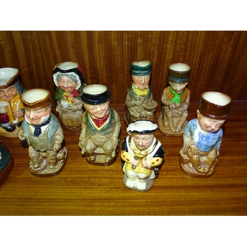 100 - A collection of Royal Doulton small Toby jugs, including 